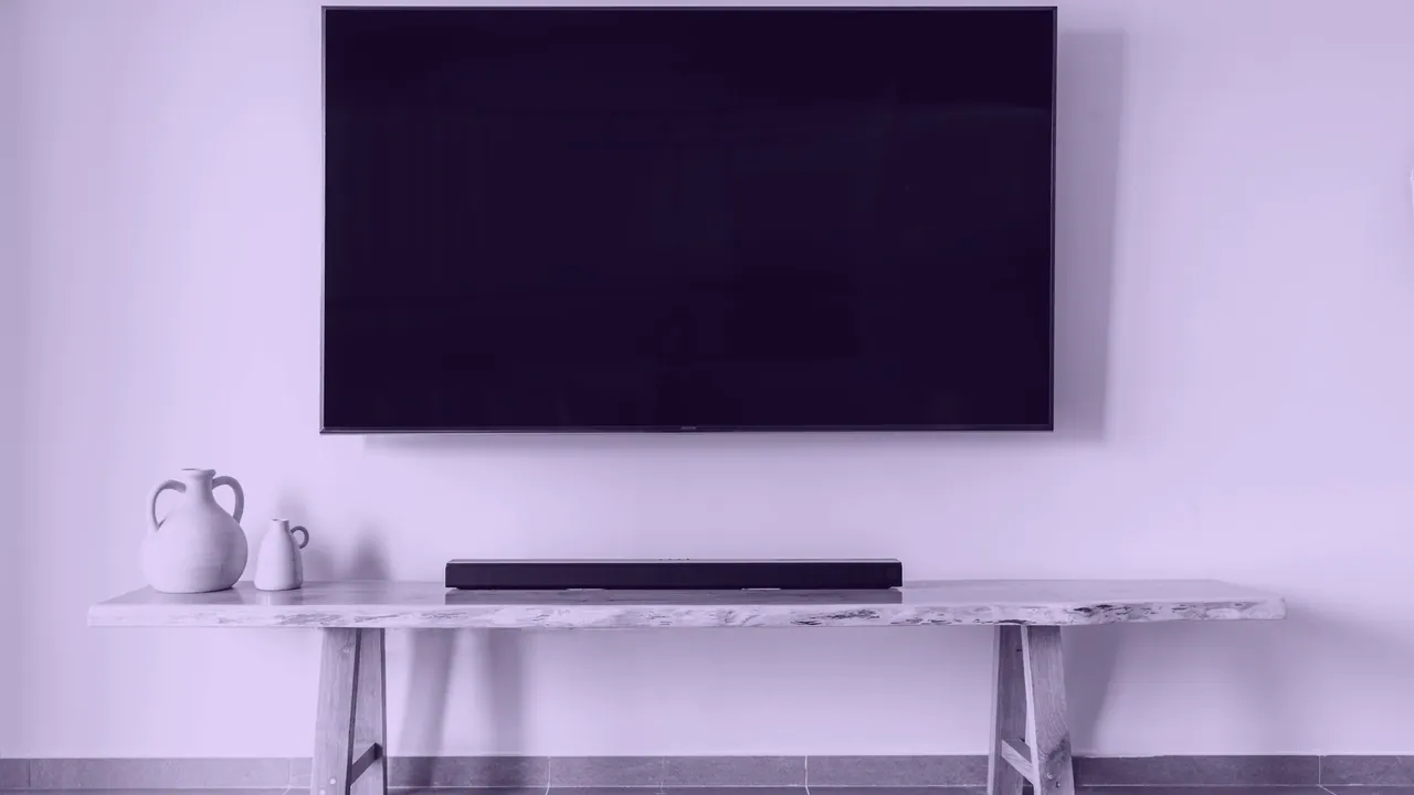 A large flat screen television on a wall.