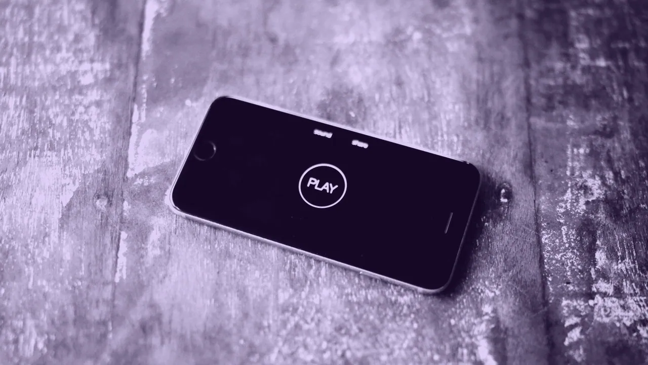 An iPhone lying face up on a table.