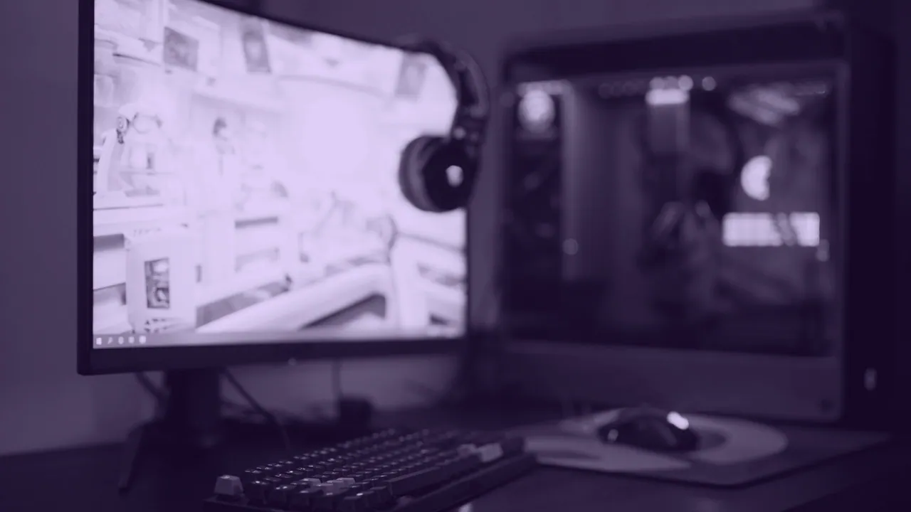 A desktop gaming machine beside its monitor.