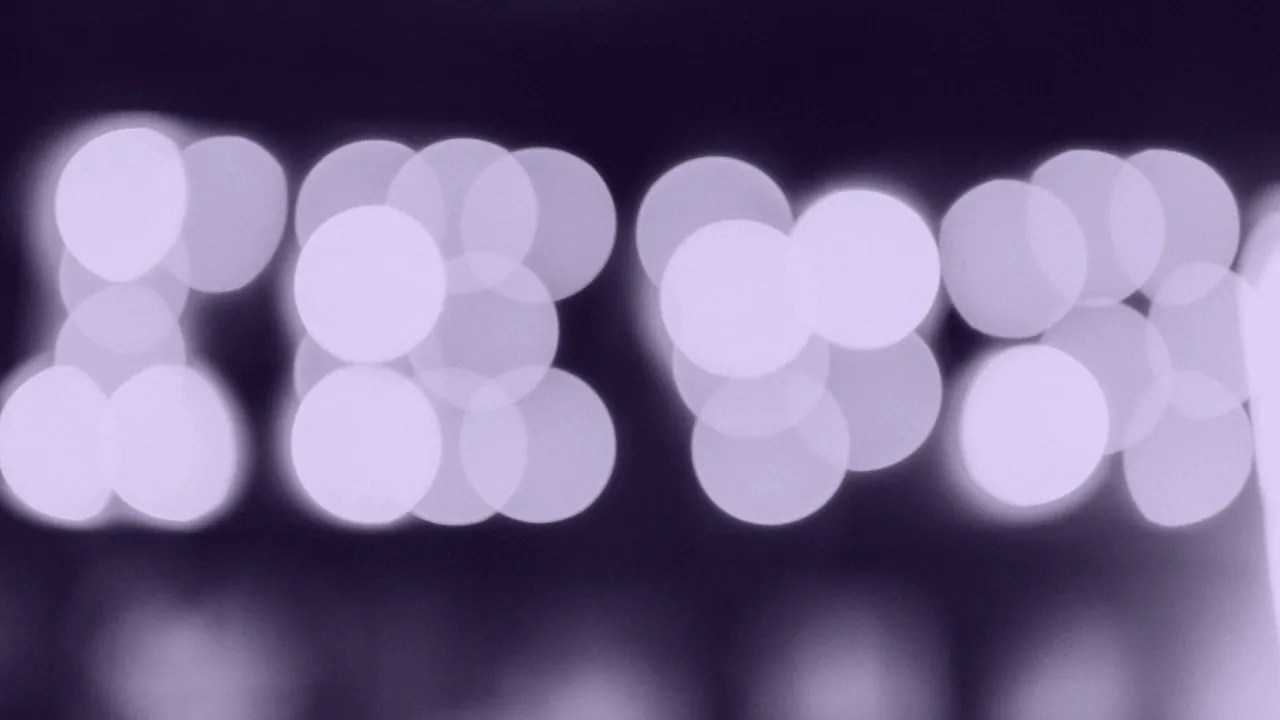 A lit screen thrown completely out of focus.